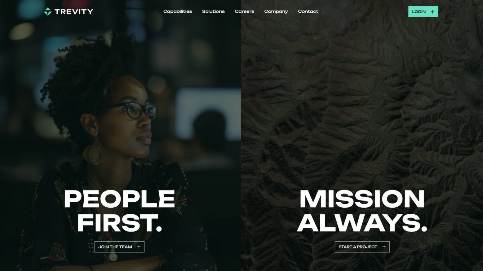 A woman with glasses and earrings is focused on her work in a dimly lit environment.