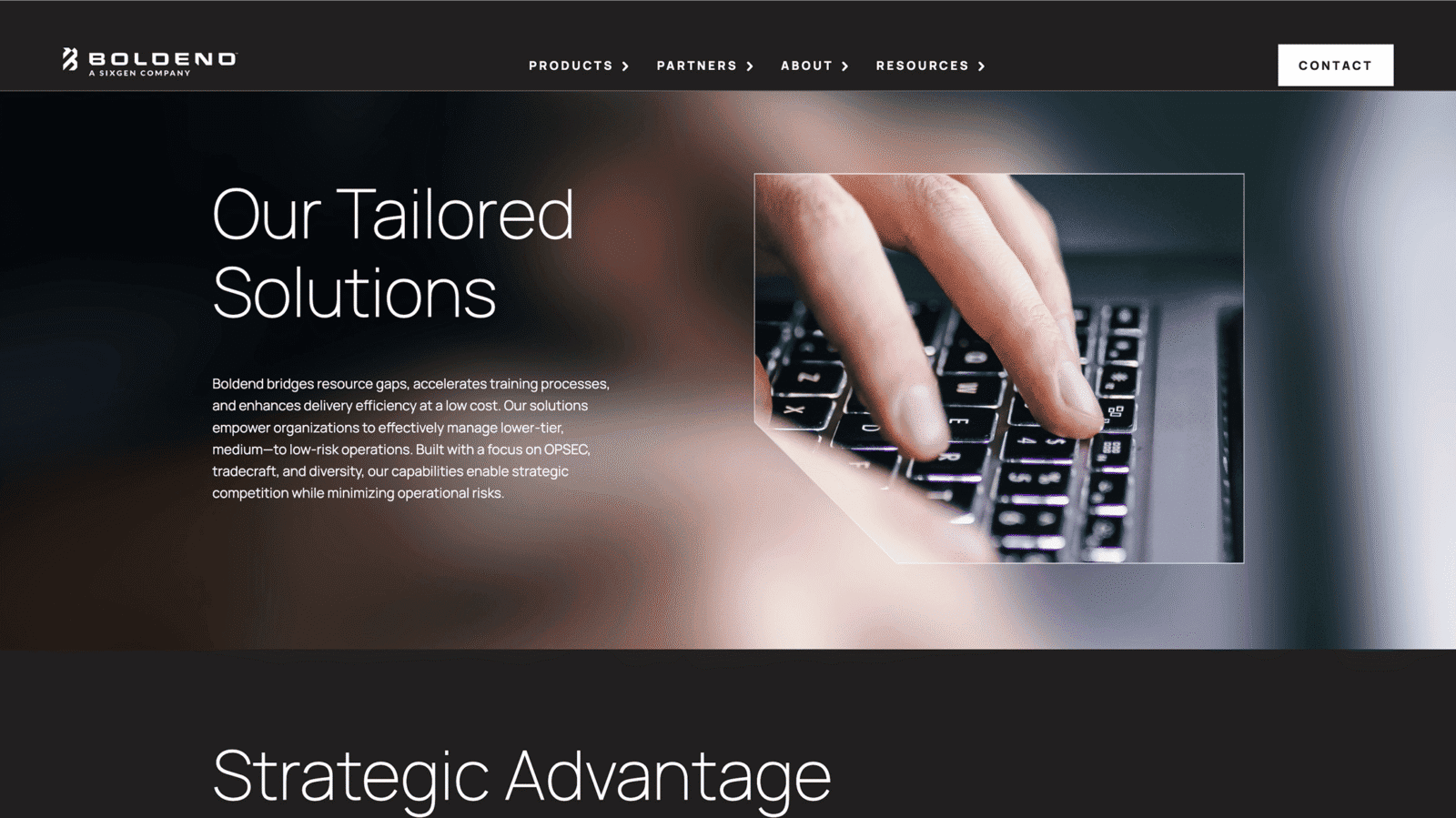 A close-up of a hand typing on a backlit keyboard with a transparent overlay highlighting the keys.