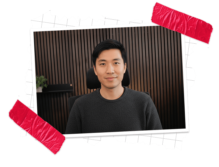 Portrait of a person seated in a chair against a wood-slat wall background, framed by a torn-paper graphic with red tape accents.